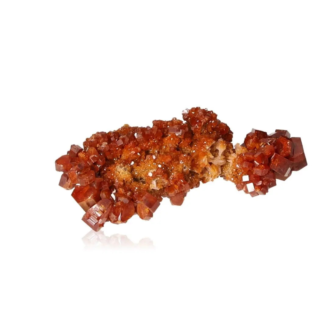 Vibrant red-orange Vanadinite druze crystal, ideal for enhancing focus, creativity, and energy in collectors and creatives.