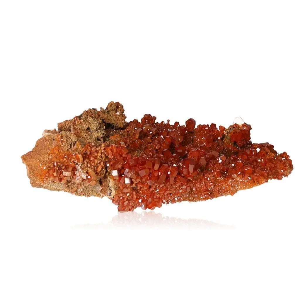 Vibrant red-orange Vanadinite Druze mineral crystal, known for its grounding energy and focus-enhancing properties, perfect for collectors.