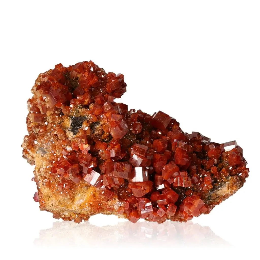 Vibrant red-orange Vanadinite Druze crystal with unique formations, ideal for collectors and boosting focus and creativity.