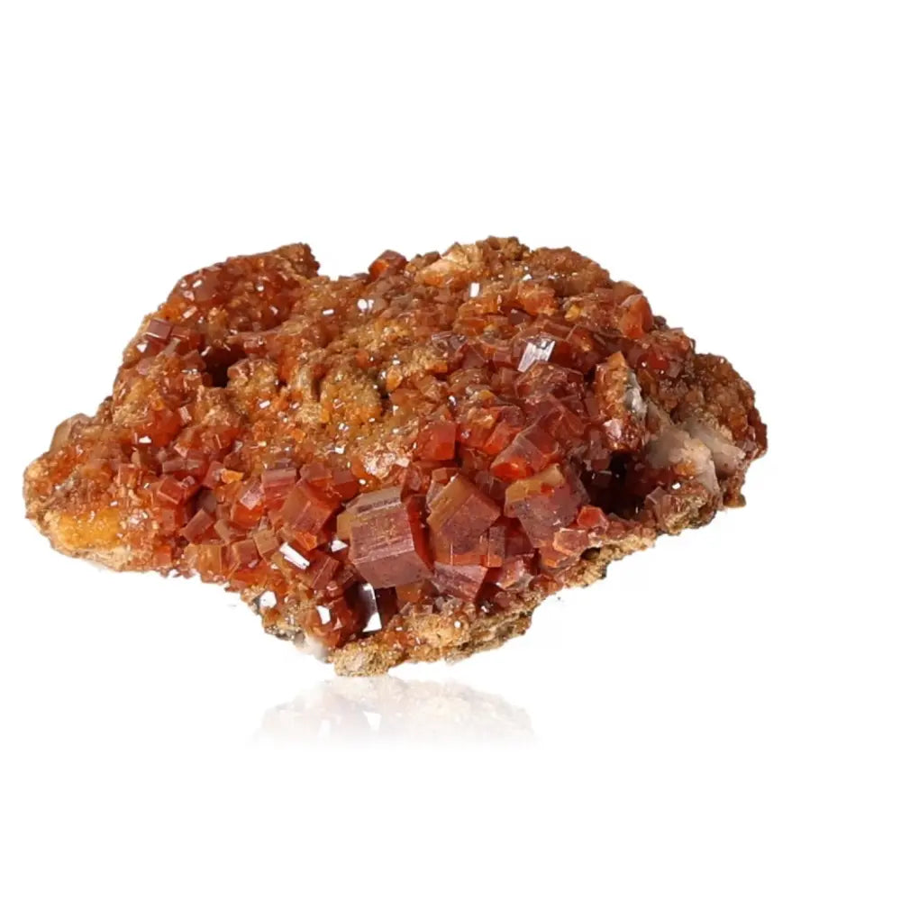 Vibrant red-orange vanadinite druze crystal formation showcasing its unique structure, ideal for collectors and creativity enhancement.