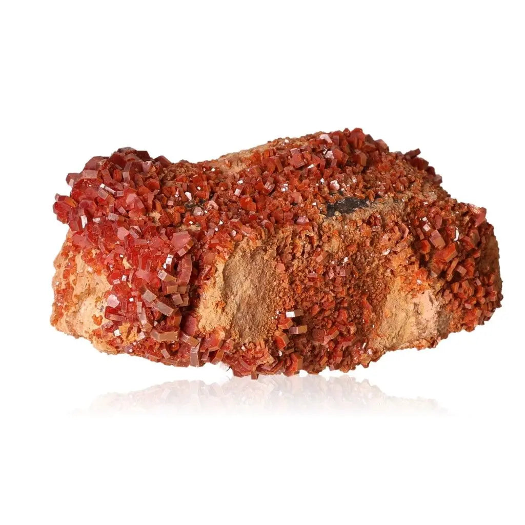 Vibrant red-orange Vanadinite druzy mineral stone with unique crystal formations, ideal for collectors and boosting focus and creativity.