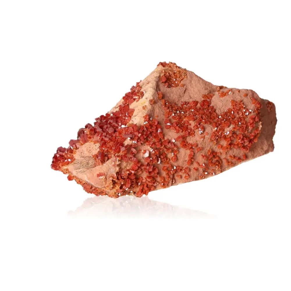 Vanadinite druzy crystal with vibrant red-orange hues, known for enhancing focus and creativity, ideal for mineral collectors and creatives.