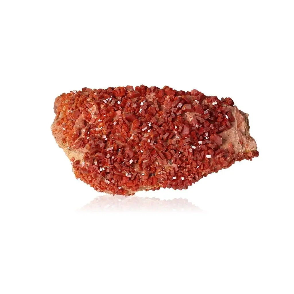 Vibrant red-orange vanadinite druze crystal, known for enhancing focus and creativity, ideal for collectors and creatives.