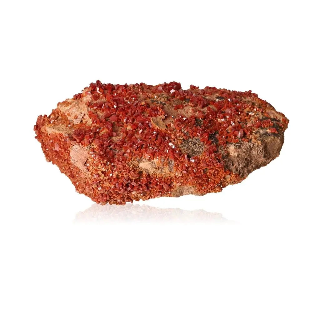 Vibrant red-orange vanadinite druze crystal known for focus and creativity, perfect for collectors and creative energy seekers.