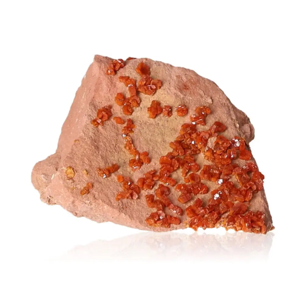 Vanadinite druzy on rock displaying vibrant red-orange crystals, known for enhancing focus and creativity, ideal for collectors and creatives.