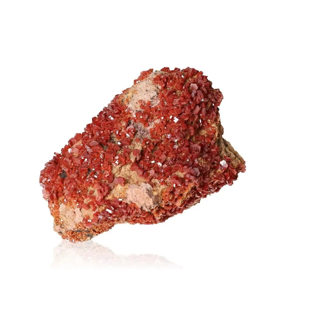 Vibrant vanadinite druzy mineral with striking red-orange crystals, enhancing focus and creativity for collectors and creatives.