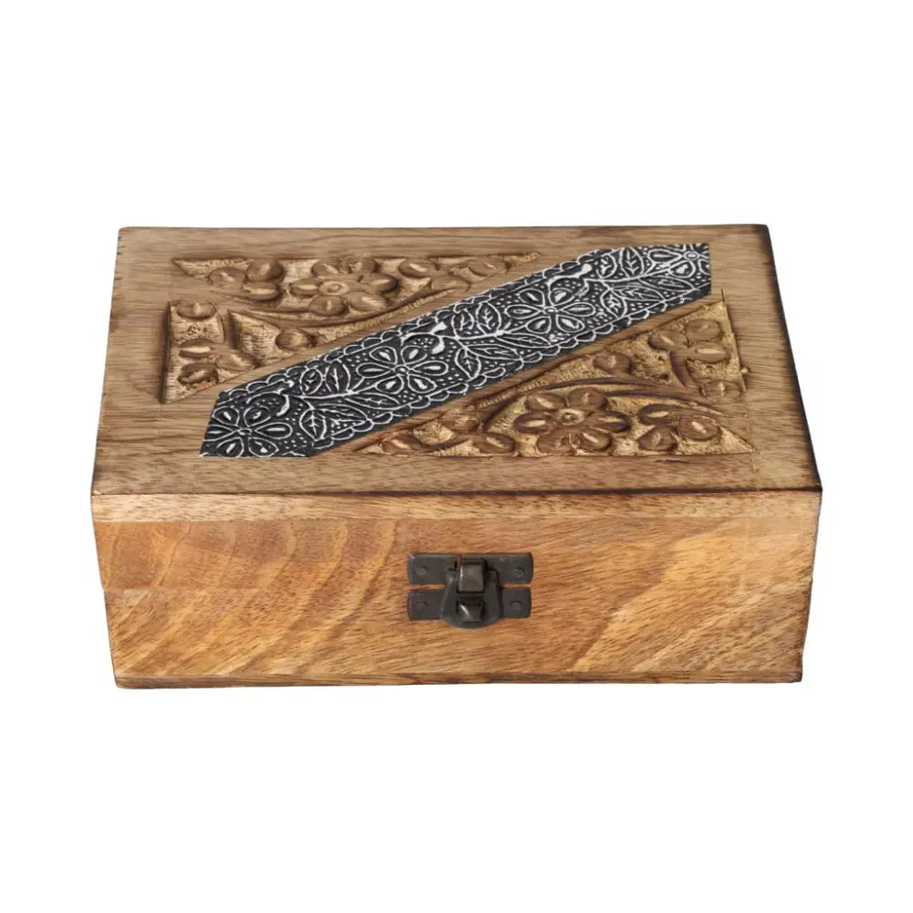 Ornate wooden jewelry box with intricate carvings, representing luxury and spiritual connection, by Sylvia Crystals.