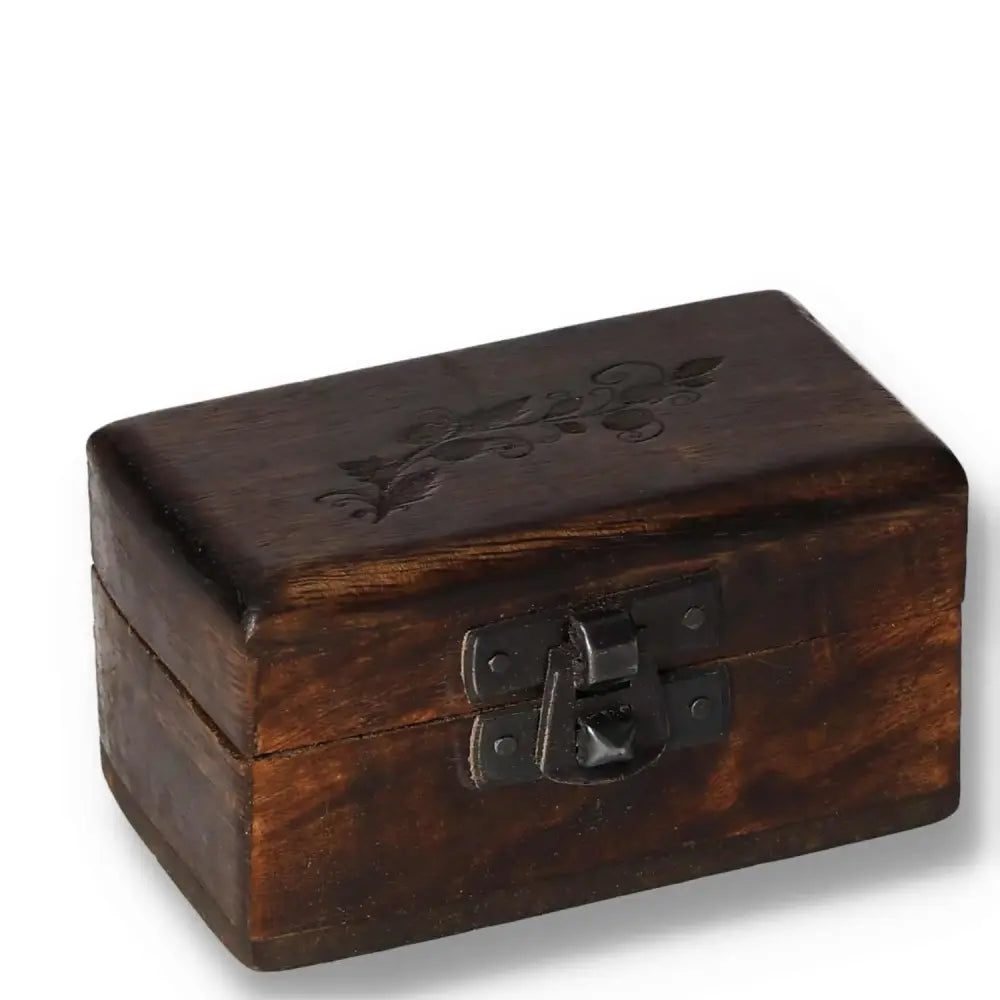 Handcrafted wooden pill box with carved design, 9x5x4cm, featuring an elegant latch closure. Perfect for small item storage.