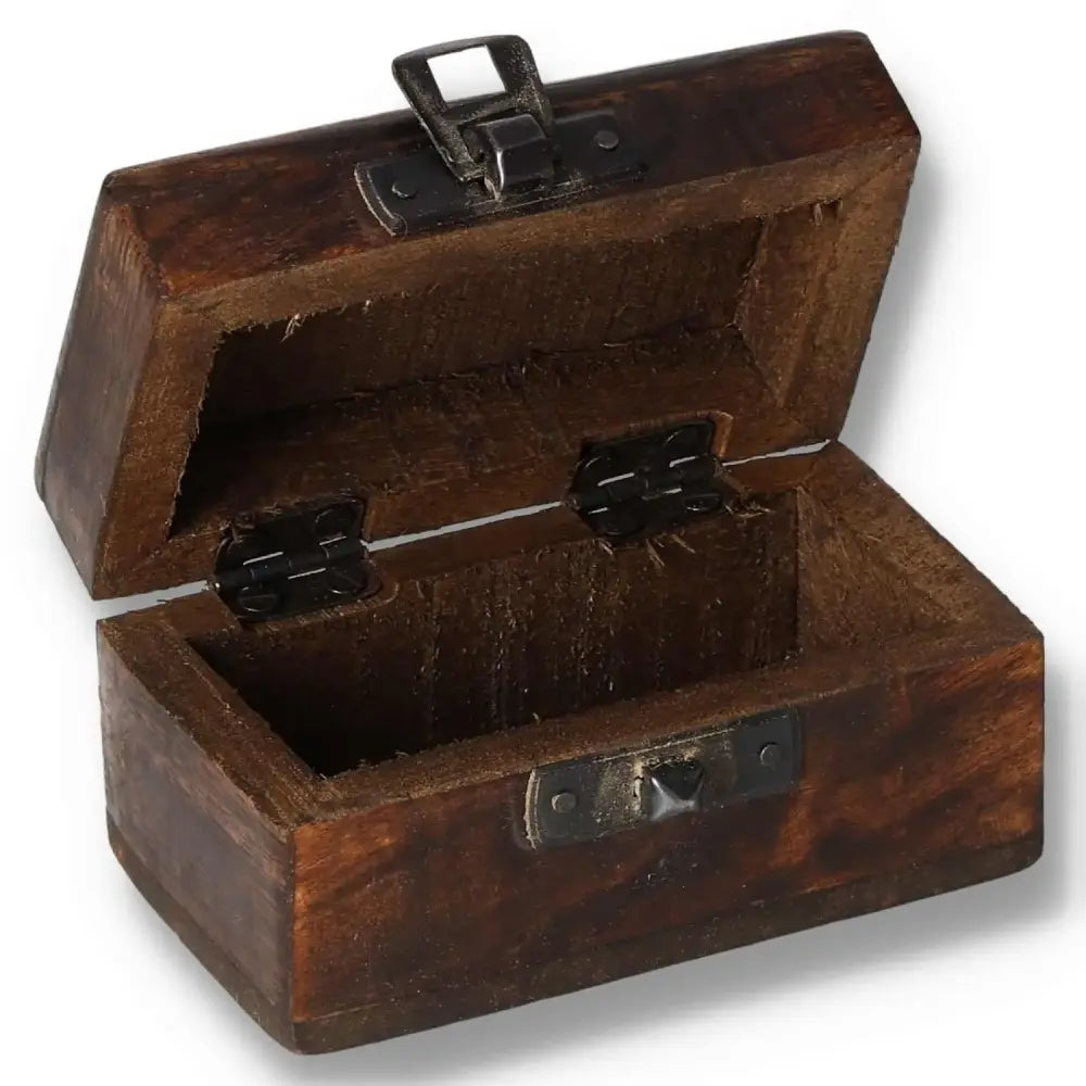 Open carved wooden pill box with rustic finish, measuring 9x5x4cm, showcasing intricate designs and metal hinges.
