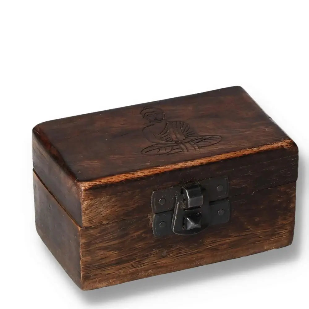 Carved wooden pill box, 9x5x4 cm, featuring intricate designs with a secure clasp, ideal for storing small items in style.