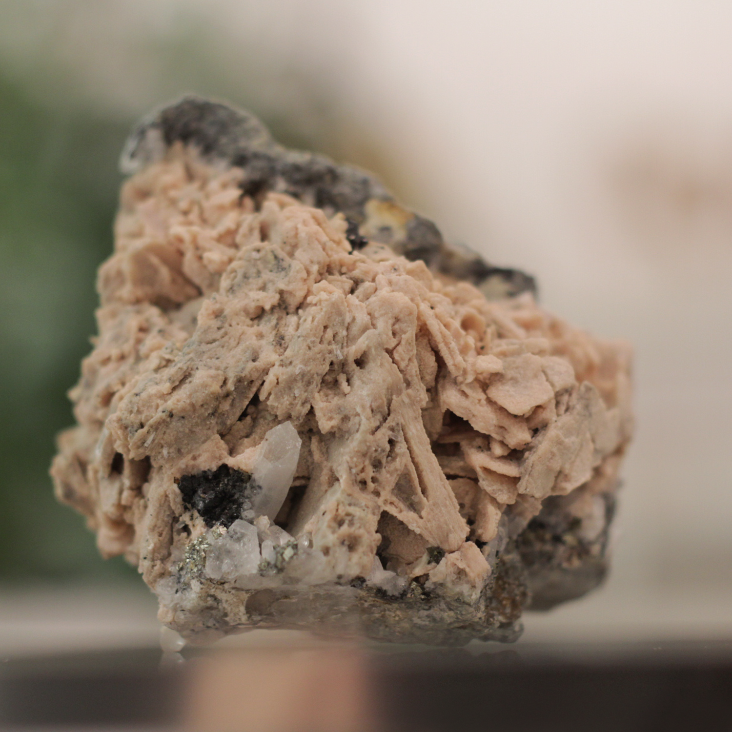 Raw Rhodonite gemstone in pink and black, known for emotional healing and balance, ideal for meditation and energy work.