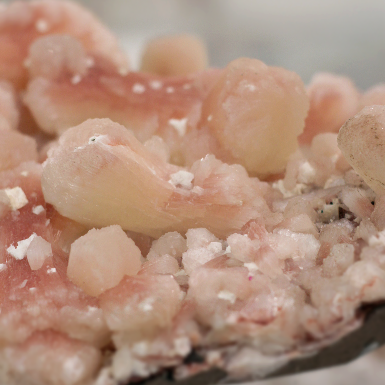 Stilbite gemstone cluster with pink and green hues promoting love and creativity.