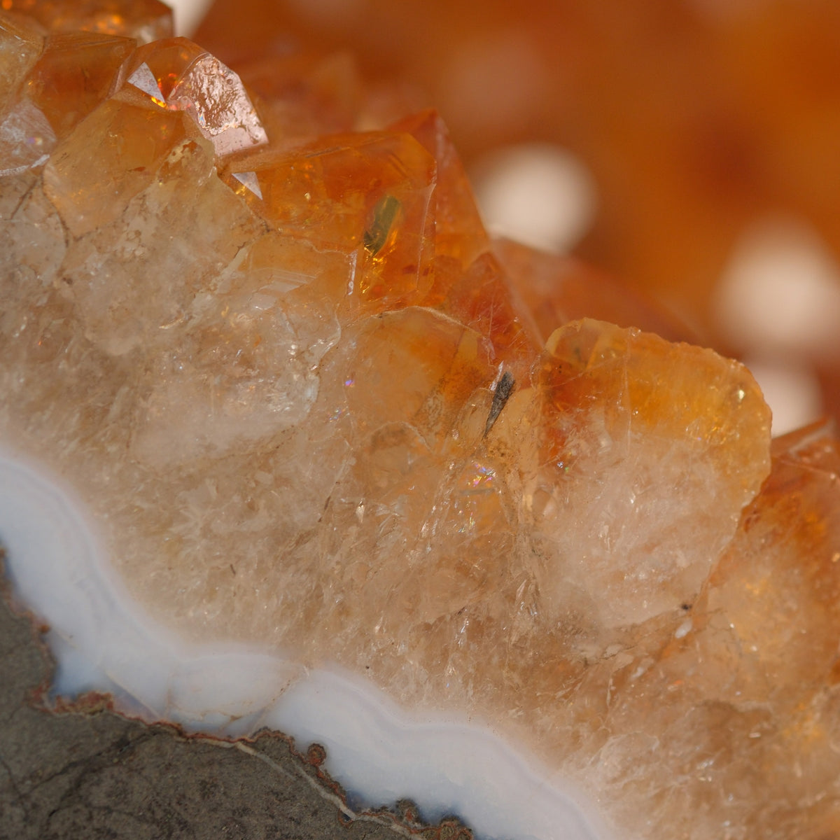 Raw citrine crystal cluster showcasing its vibrant golden hue and natural form, symbolizing abundance and positivity.