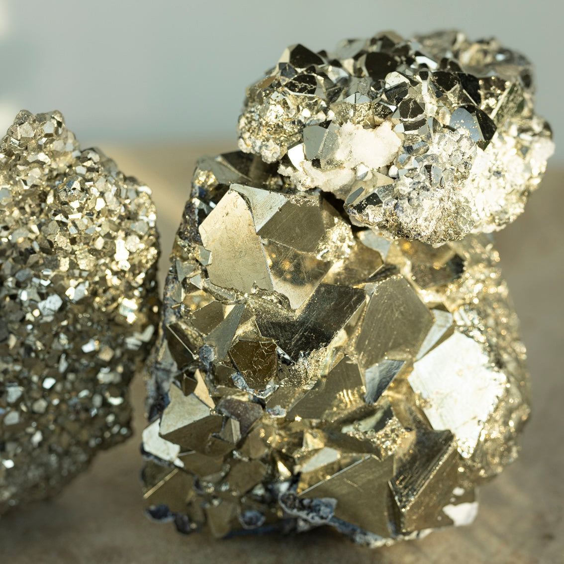 Pyrite mineral with metallic luster and golden-yellow color, often called Fool's Gold, showcasing its cubic crystal structure.