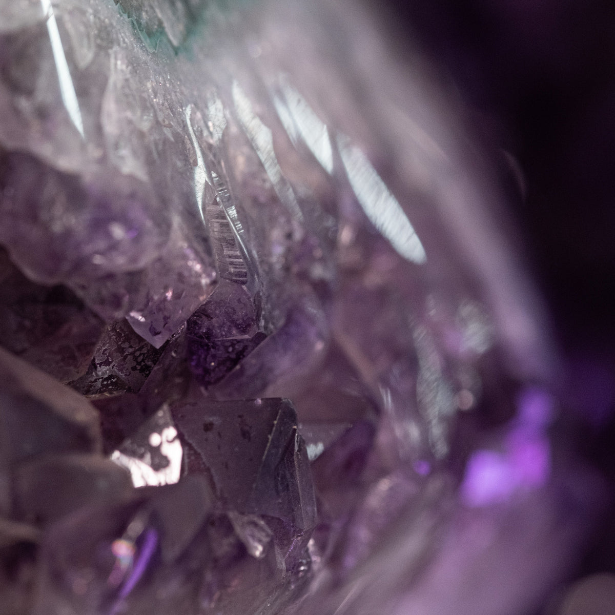 Amethyst crystal cluster showcasing its natural purple hues, symbolizing peace, protection, and spiritual growth.