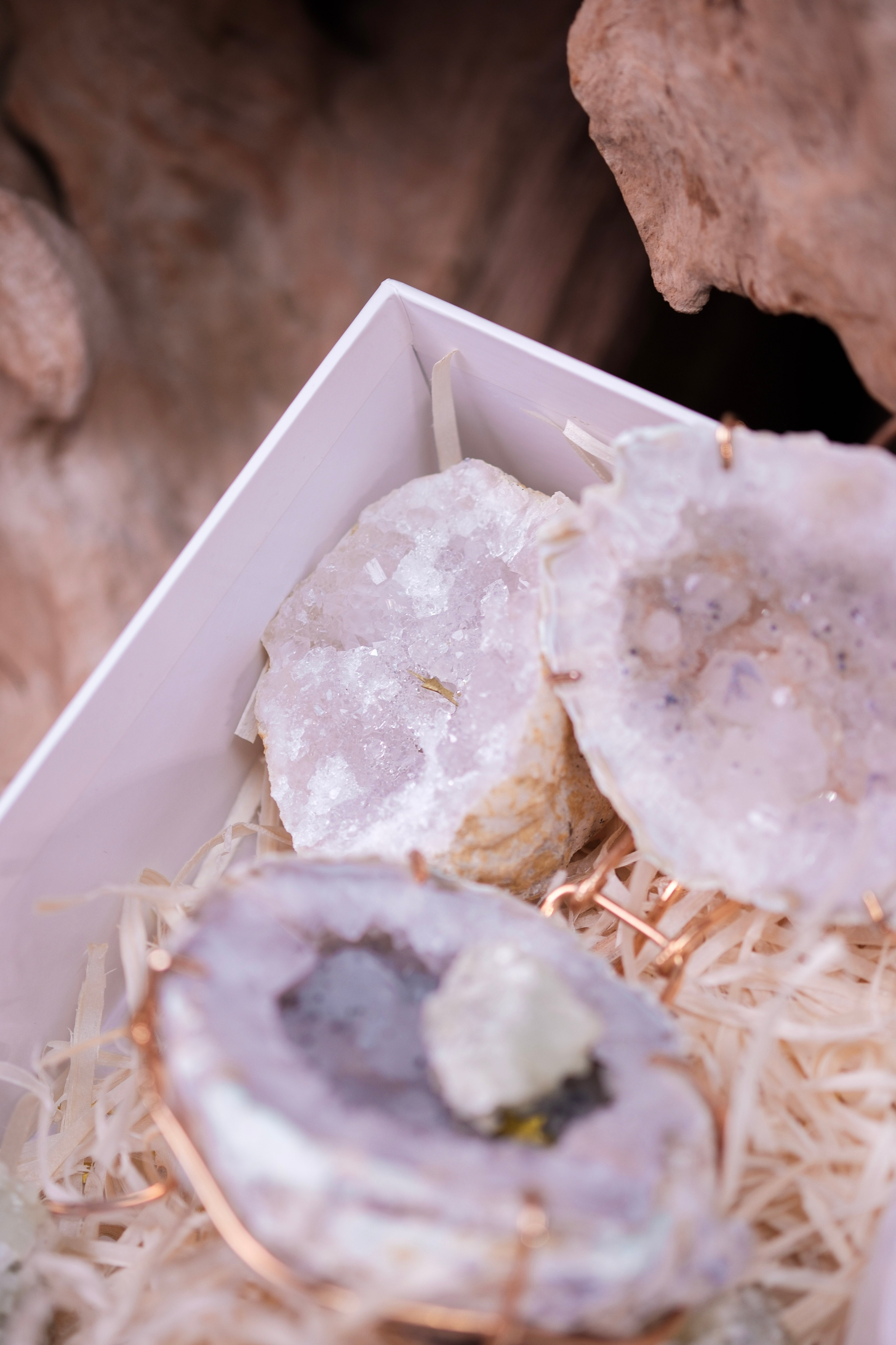 Close-up of crystals and geodes in a box from the Angelic Elegance Christmas Gift Box by Sylvia Crystals.