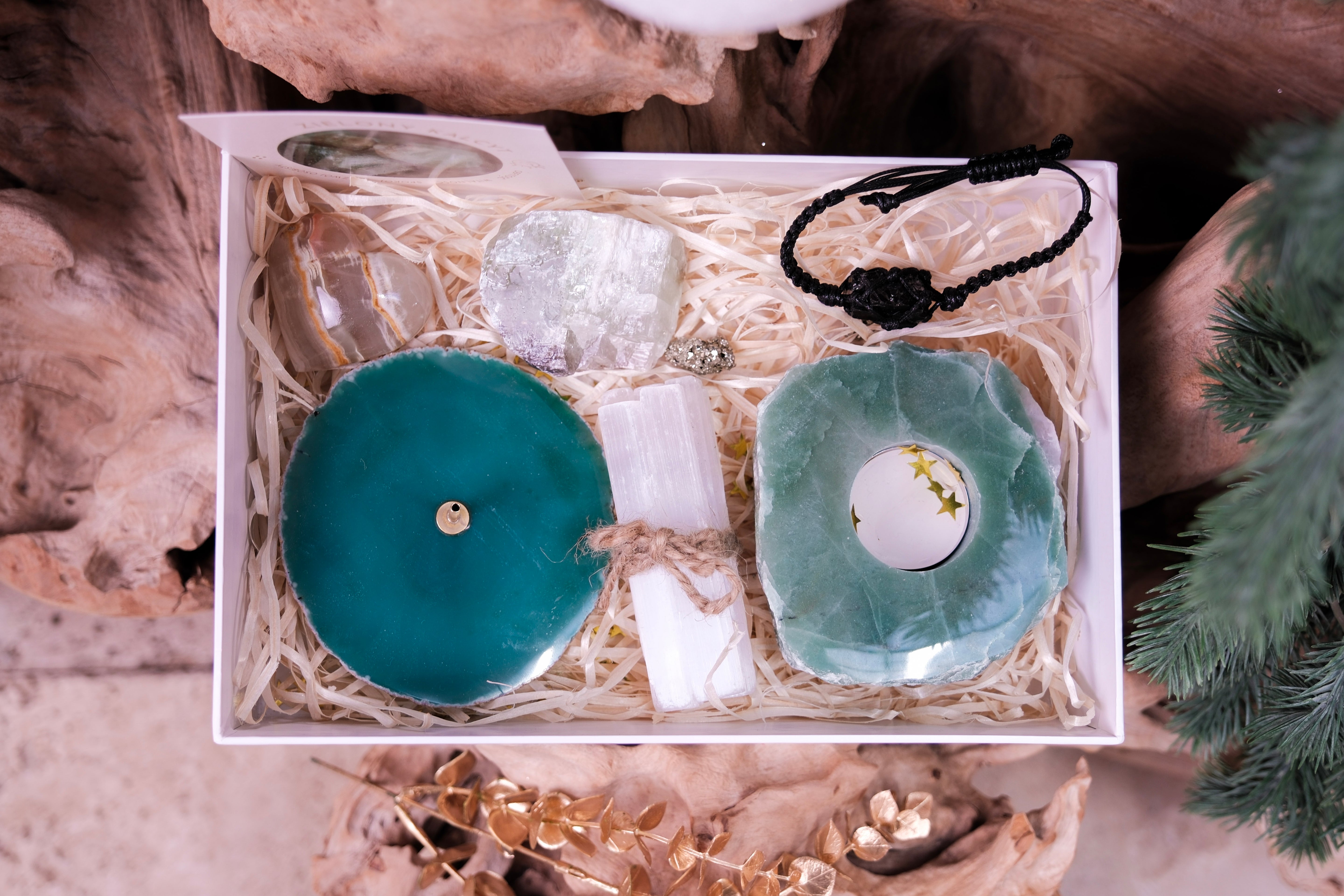 Christmas Crystal Gift Set with turquoise crystals, wellness treasures, and festive accents in a gift box for harmony and positivity.