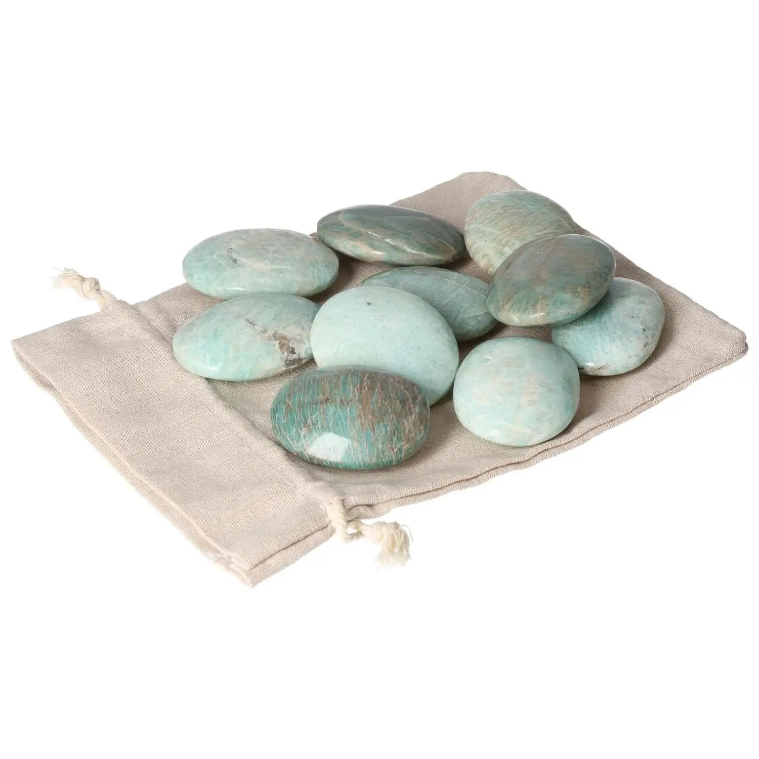 Amazonite palm stones on a beige pouch, showcasing their calming blue-green hues and smooth, polished surface for spiritual well-being.
