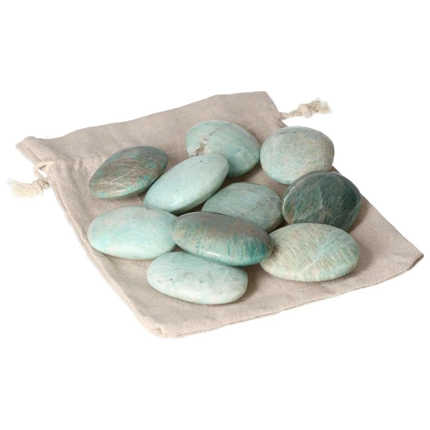 Amazonite palm stones on a beige pouch, showcasing their calming green hues, perfect for spiritual well-being and conscious luxury.