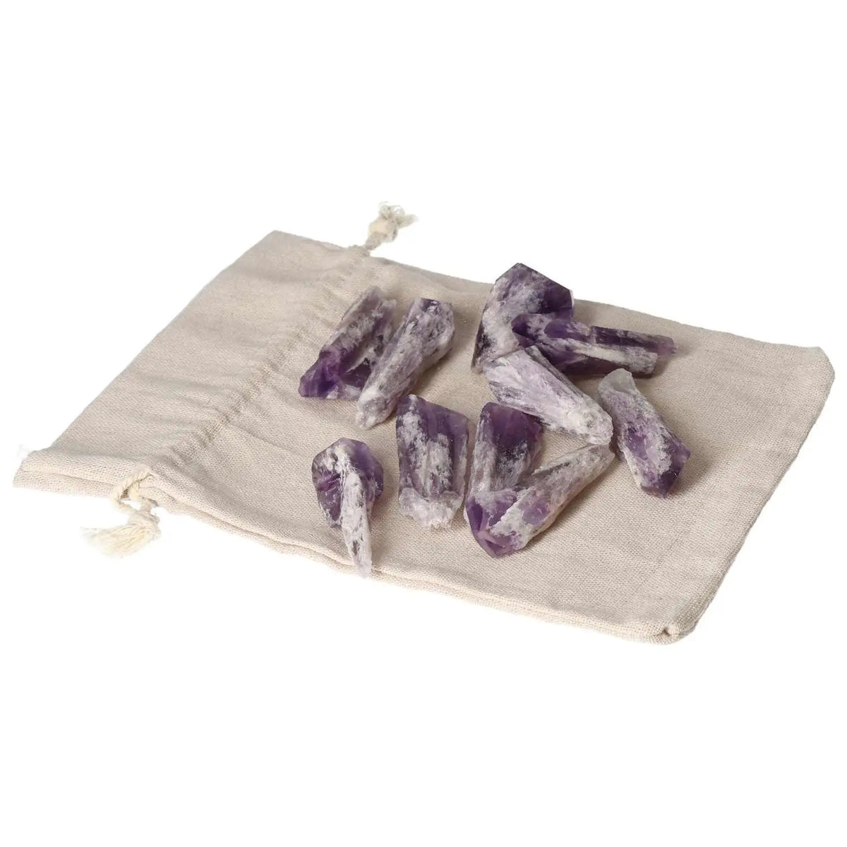 Amethyst Point S crystals from Sylvia Crystals on a beige drawstring pouch, symbolizing serenity, sophistication, and stress reduction.