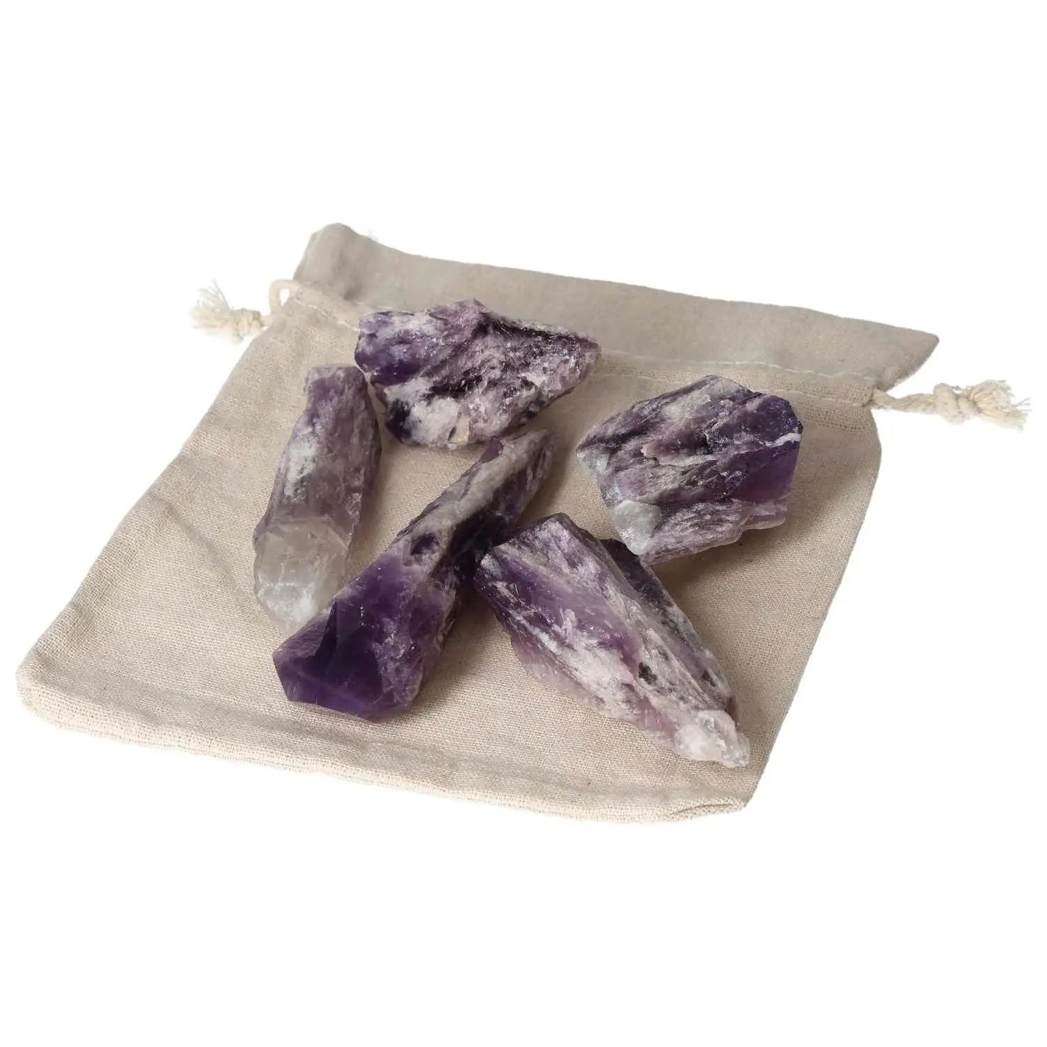Amethyst Point L crystals on a beige cloth bag, showcasing vibrant purple hues and natural formations from Sylvia Crystals for energy boosting.