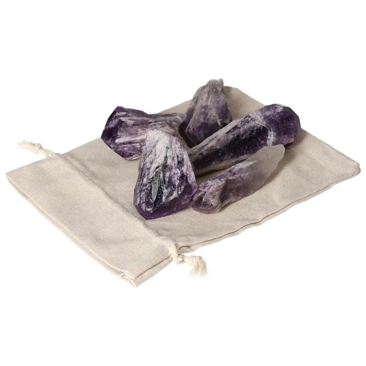 Amethyst Point L crystals on a beige pouch, highlighting their deep purple hues and natural beauty from Sylvia Crystals.