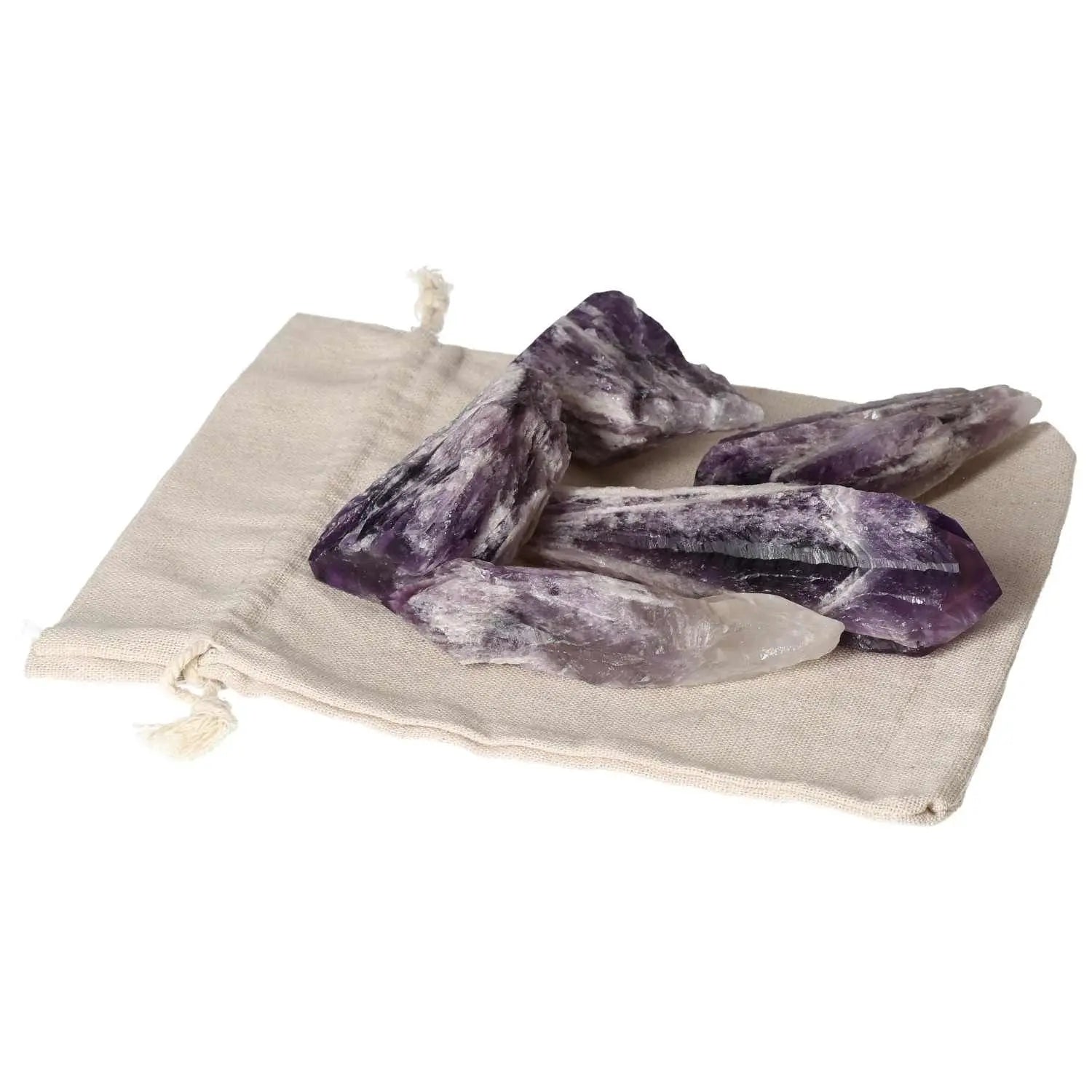 Amethyst Point L crystals from Sylvia Crystals displayed on a cloth pouch, highlighting their beauty and spiritual benefits.