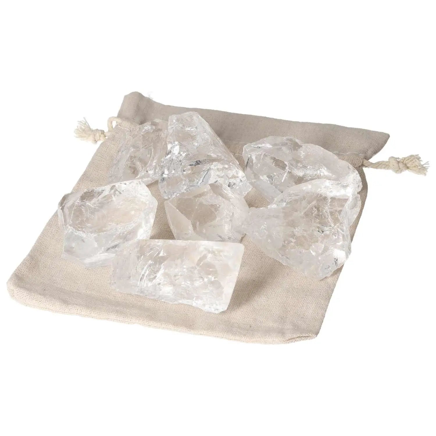 Quartz Clear crystals on a beige cloth bag, showcasing clarity and elegance from Sylvia Crystals, ideal for spiritual balance seekers.
