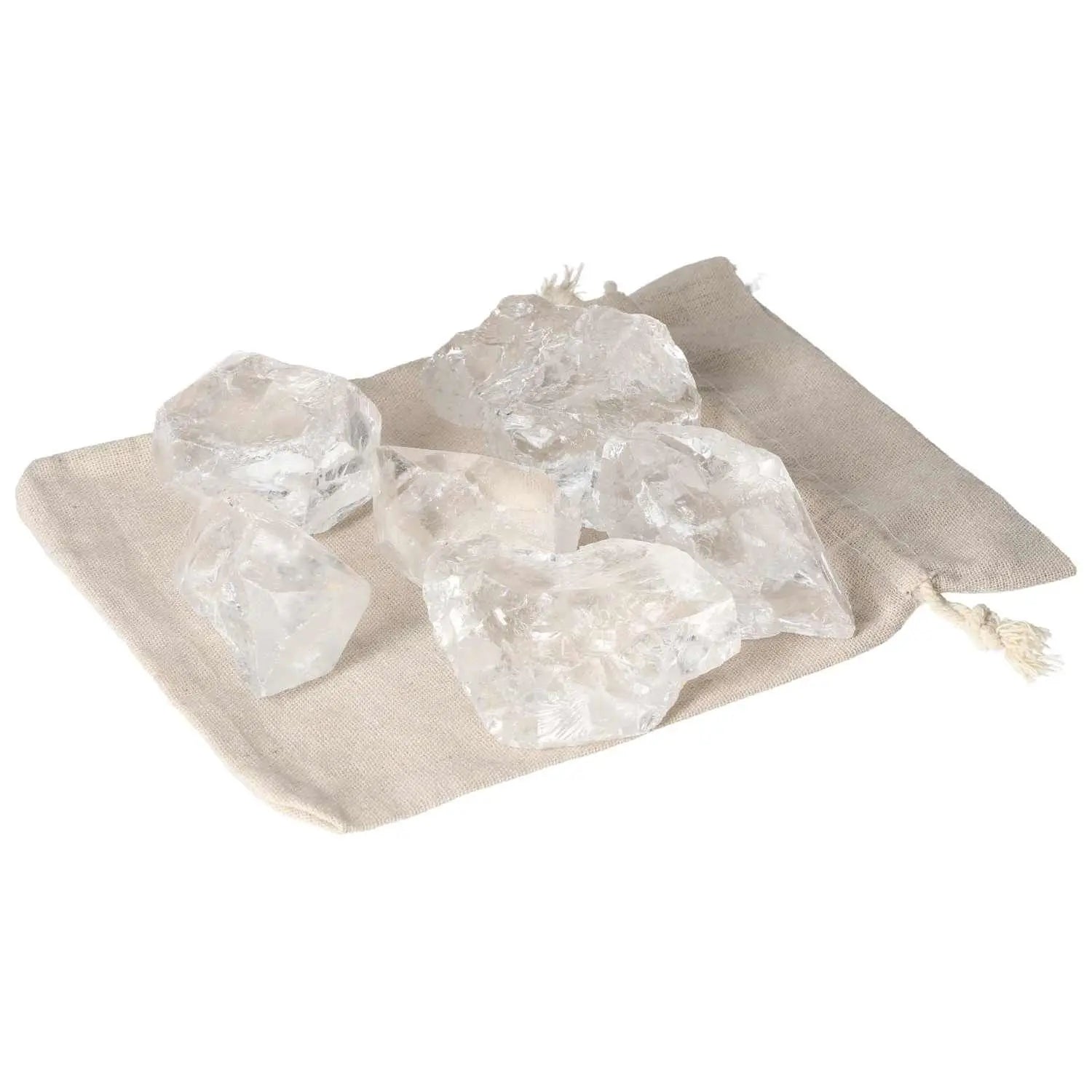 Quartz Clear crystals on a beige pouch showcasing elegance and cleansing properties, perfect for balance and spiritual harmony.