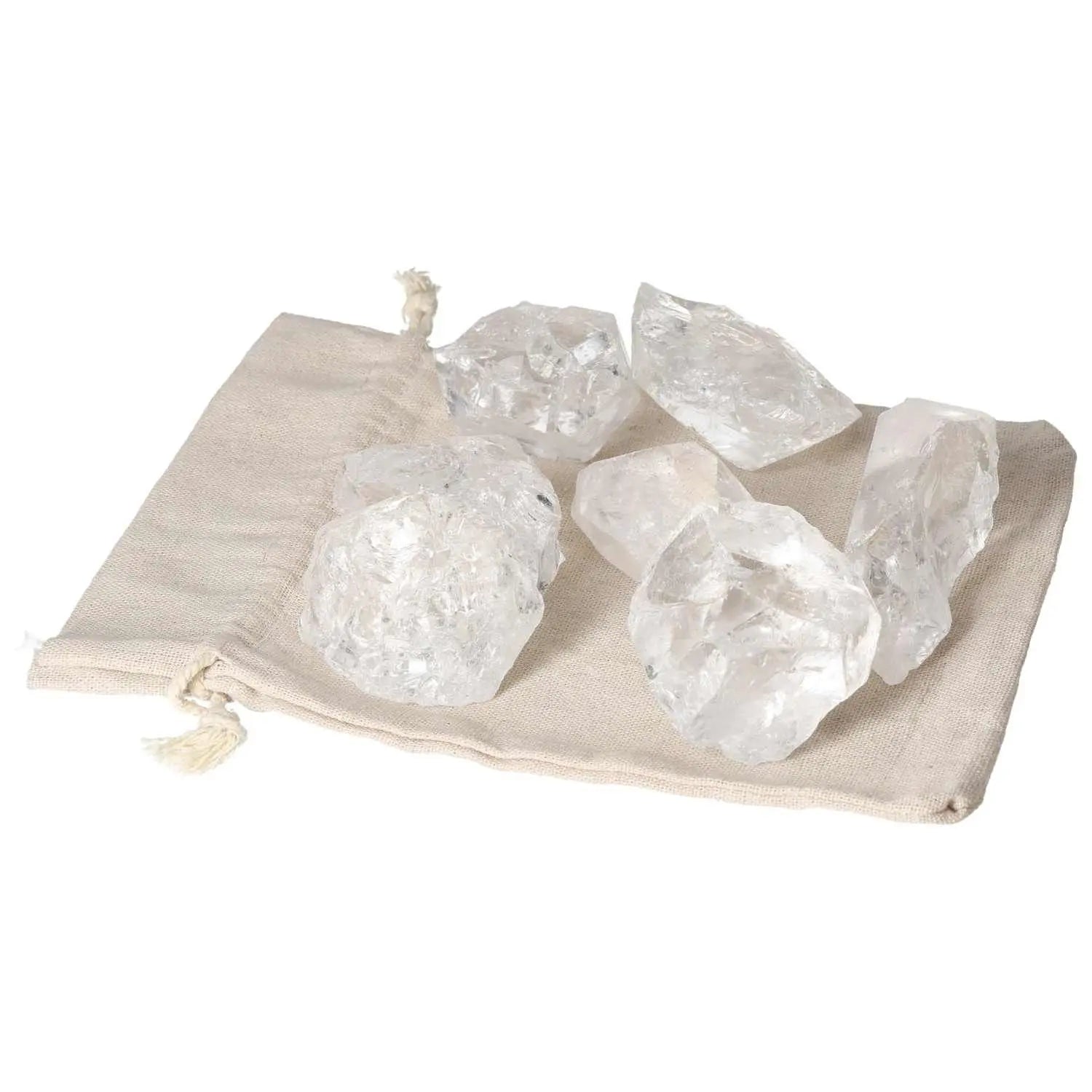 Quartz Clear crystals from Sylvia Crystals displayed on a beige cloth, showcasing their clarity and quality for spiritual harmony.