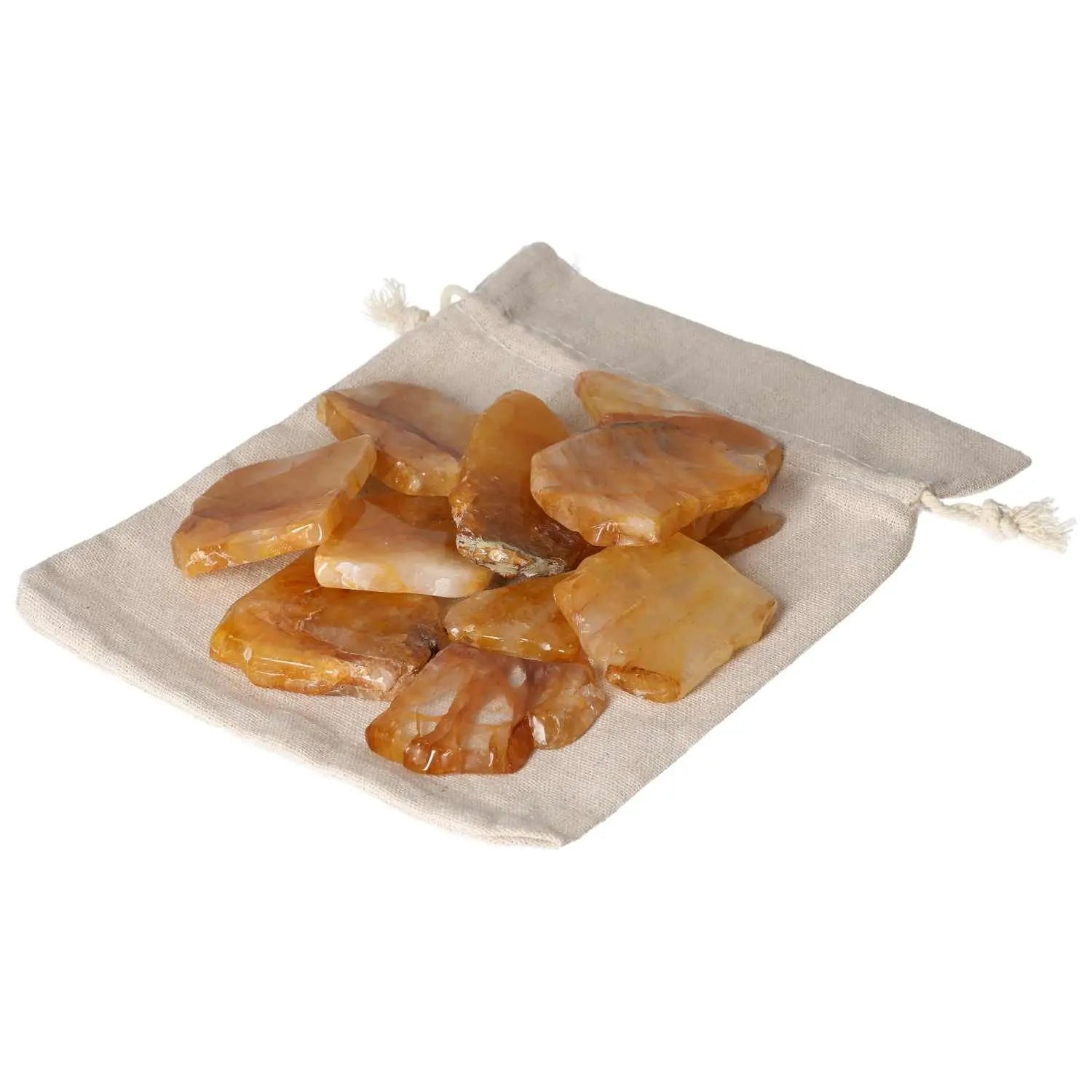 Hematoide Yellow Slice crystals on a fabric pouch, showcasing Sylvia Crystals' premium collection with spiritual and aesthetic elegance.