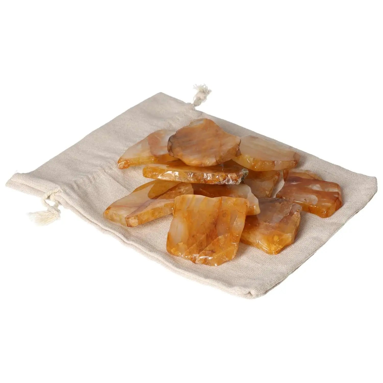 Hematoide Yellow Slice crystals on a fabric pouch, showcasing their elegant and spiritual allure from Sylvia Crystals.