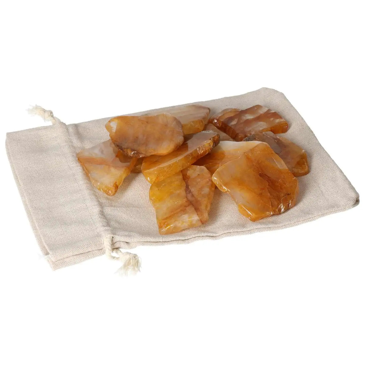 Hematoide Yellow Slice crystals in a cloth pouch, showcasing their elegance and spiritual charm.