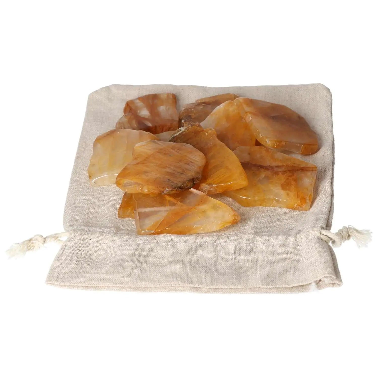 Hematoide Yellow Slice crystals on a drawstring pouch, offering spiritual harmony and elegance, by Sylvia Crystals.