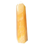Mexican Calcite Obelisk by Sylvia Crystals, premium gem for space embellishment and personal growth, renowned for enhancing self-confidence.
