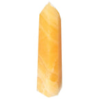 Mexican Calcite Obelisk by Sylvia Crystals, premium gem, enhances self-confidence, natural beauty for personal growth and motivation.