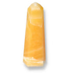 Mexican Calcite Obelisk by Sylvia Crystals, offering transformative energy and luxurious design for positivity and self-discovery.