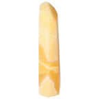 Mexican Calcite Obelisk by Sylvia Crystals, known for spiritual significance and personal growth, made from premium calcite.