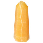 Mexican Calcite Obelisk from Sylvia Crystals, enhances confidence and motivation, premium handpicked quality, uplifting energy.