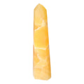 Mexican Calcite Obelisk from Sylvia Crystals promoting positive energy and spiritual growth.