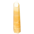 Mexican Calcite Obelisk from Sylvia Crystals, symbolizing motivation and positive energy, high-quality and authentic decorative piece.