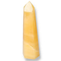 Mexican Calcite Obelisk from Sylvia Crystals showcasing a vibrant yellow hue, known for boosting positivity and self-confidence.