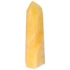 Mexican Calcite Obelisk from Sylvia Crystals, a handpicked piece symbolizing beauty and energy transformation.