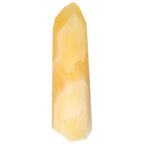 Mexican Calcite Obelisk by Sylvia Crystals, a decorative and spiritual energy transformation tool in yellow calcite.
