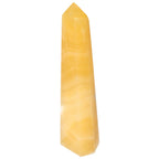 Mexican Calcite Obelisk by Sylvia Crystals, luxury decorative and spiritual accessory for personal growth and transformation.