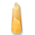 Mexican Calcite Obelisk from Sylvia Crystals, enhancing self-confidence and motivation, great for luxury and spiritual growth.