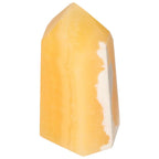Mexican Calcite Obelisk by Sylvia Crystals, a luxury decorative piece promoting self-confidence and spiritual growth.