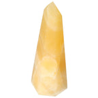 Elegant Mexican Calcite Obelisk from Sylvia Crystals, showcasing aesthetic beauty and spiritual enhancement; perfect for conscious luxury.
