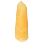 Mexican Calcite Obelisk from Sylvia Crystals, symbolizing motivation, self-confidence, and energy for spiritual growth.