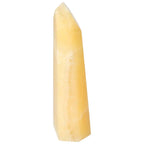 Mexican Calcite Obelisk from Sylvia Crystals, enhancing positivity, confidence, and concentration with elegant spiritual energy.